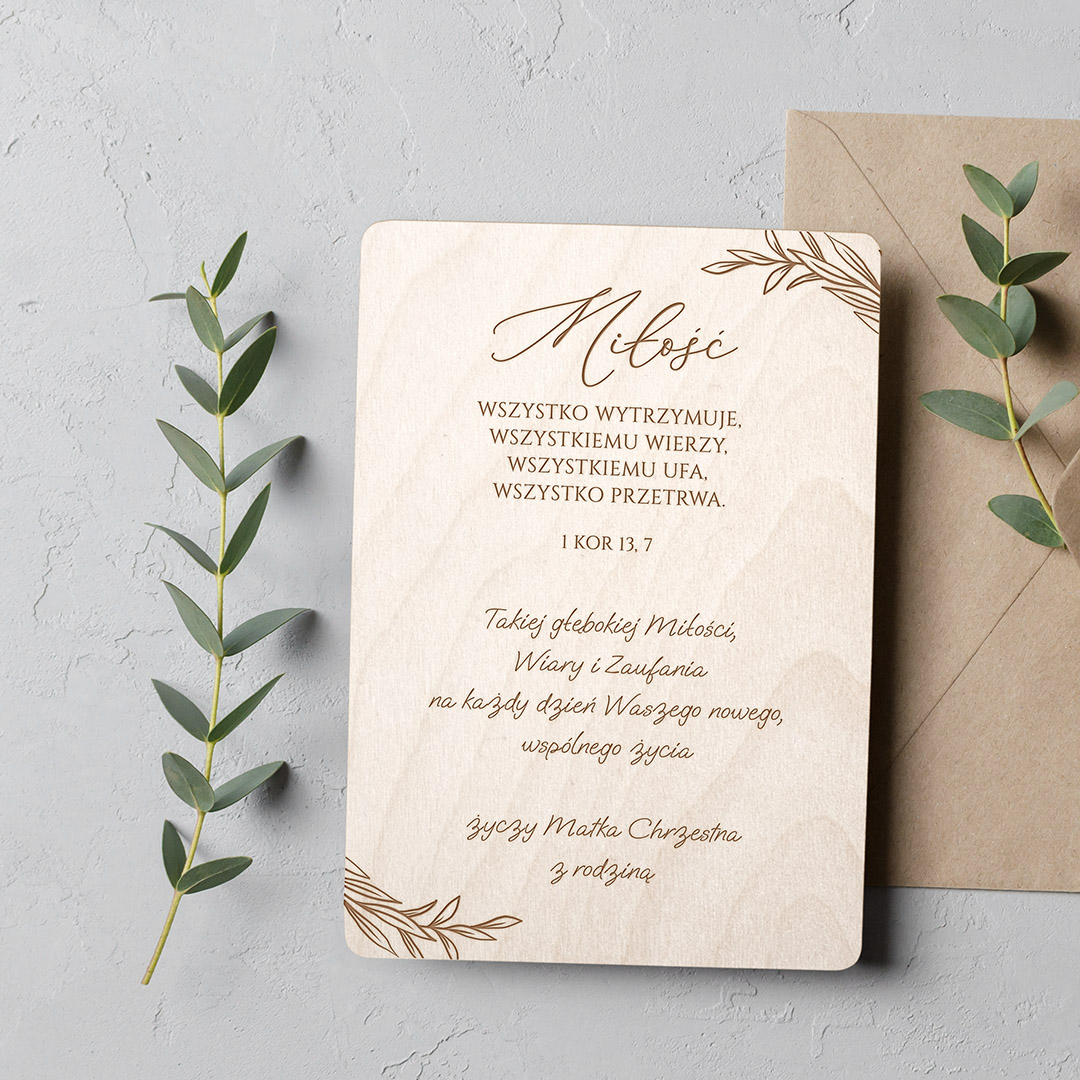 Wedding invitation or blank greeting card mockup with eucalyptus twigs and envelope